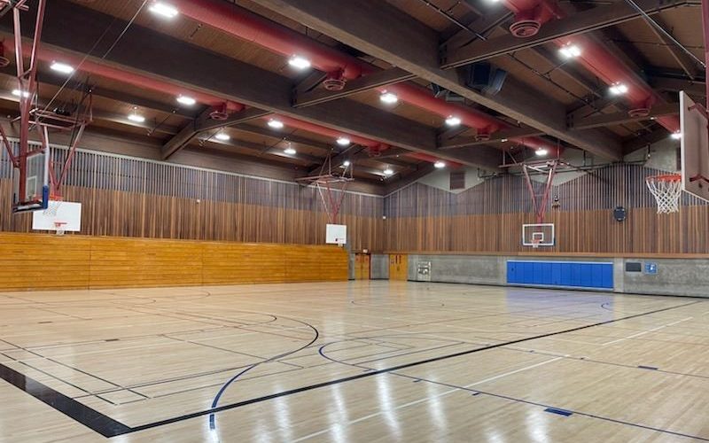 The indoor wood-floor gymnasium at Callinan Sports & Fitness Center, Rohnert Park, marked with blue pickleball lines